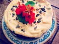Vegan carrot cake, with sunflower seeds, walnuts, ginger, pumpkin seeds topped with vanilla vegan buttercream and nistercium